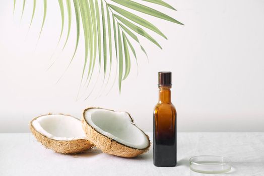 Spa cosmetics in brown glass bottles on gray concrete table. Copy space. Beauty blogger, salon therapy, minimalism concept