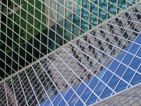 SEATTLE - JUNE 25: Glass windows of the Public Library in Seattle on June 25, 2016. The Seattle Central Library opened in 2004 and was designed by Rem Koolhaas and Joshua Prince-Ramus.