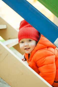 the child climbs the steps on the playground. High quality photo