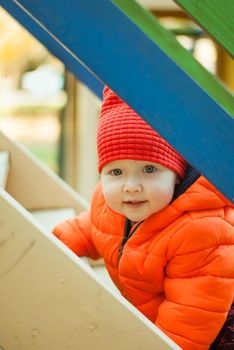 the child climbs the steps on the playground. High quality photo