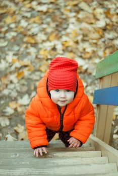 the child climbs the steps on the playground. High quality photo