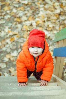 the child climbs the steps on the playground. High quality photo