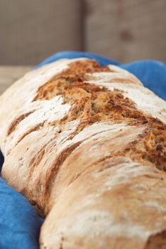 wholegrain fresh homamade bread on wooden roostick background