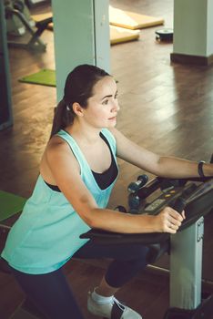 young woman training in the gym. High quality photo