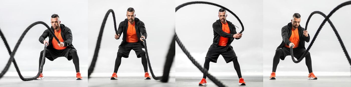 Athletic man with a battle rope doing sports exercises on the ocean.