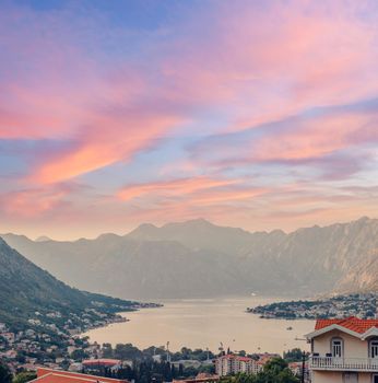 Sunset, beautiful landscape with silhouettes of trees. Travel concept. Montenegro, Kotor Bay. Sunset at Kotor Bay Montenegro. View of the sunset in Boko-Kotor Bay in Montenegro.