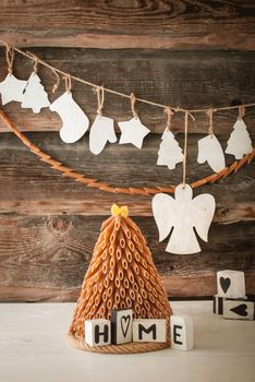 rustic styled new year tree made from pasta and wooden decoration