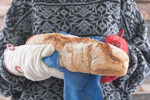 woman carry fresh hot bread. High quality photo