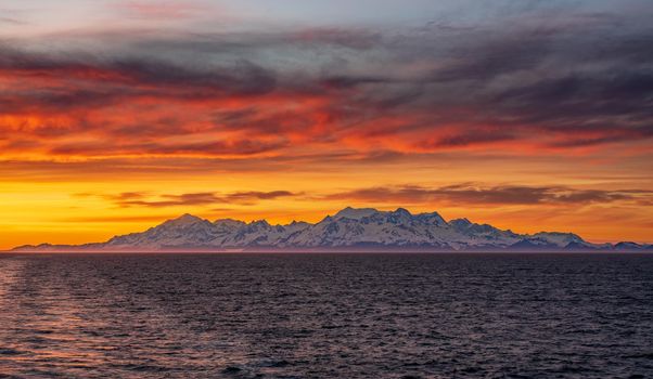 Late evening sunset on panorama of mountains and Mount Fairweather by Glacier Bay National Park in Alaska