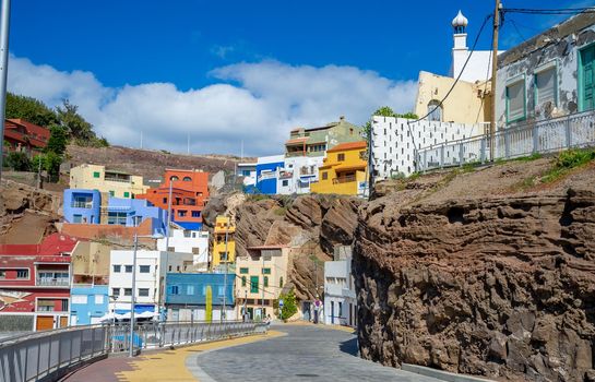 Many colourful houses on Canary island roads built on volcanic rock and sought after by many tourists
