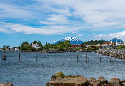 Extinct volcano of Mount Edgecumbe rises above the harbor town of Sitka in Alaska