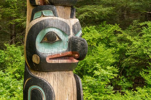 Sitka, AK - 8 June 2022: Totem poles displayed in the Sitka National Historical park in Alaska
