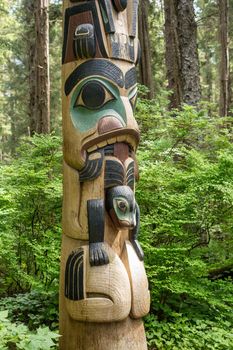 Sitka, AK - 8 June 2022: Totem poles displayed in the Sitka National Historical park in Alaska