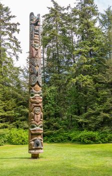 Sitka, AK - 8 June 2022: Totem poles displayed in the Sitka National Historical park in Alaska