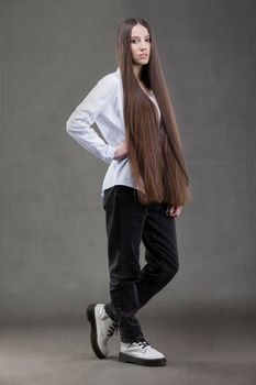 A beautiful young girl in height with long dark hair.