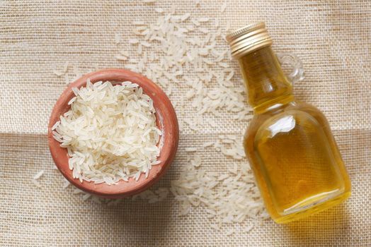 bowl of rice and oil on table ,