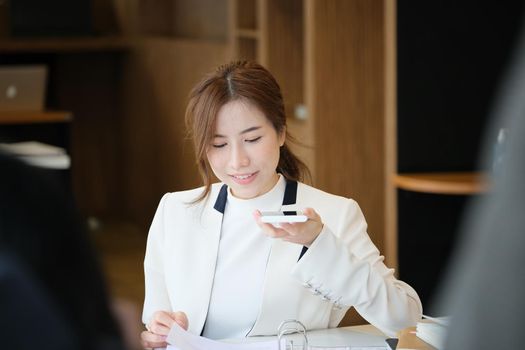 A business woman talking on the phone figured out a profitable way for her company