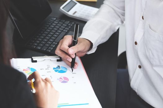 Two young business executives are discussing to change their business concept to increase profits and the strength of their business.