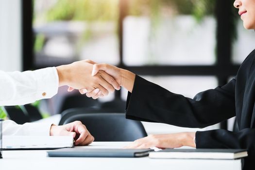 Young businessmen collaborate with partners to increase their business investment network for Plans to improve quality next month in their office. agreement concept