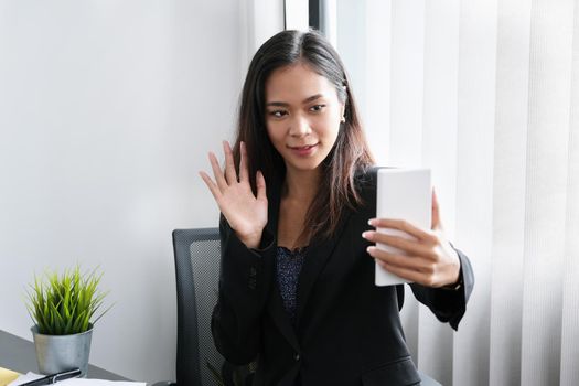 The young businesswoman is conference With people who work with use smartphone.