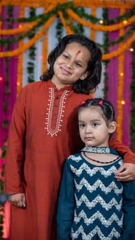 Indian children wearing ethnic Indian dress during Raksha Bandhan, a festival to celebrate the bond between brother-sister. Decoration in Indian houses.