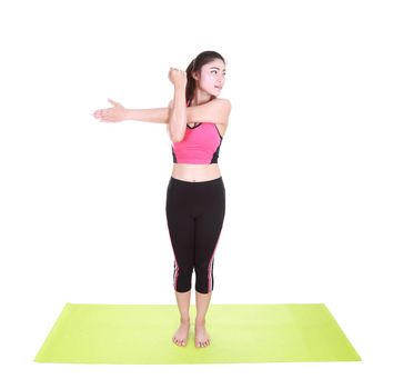 Young woman doing yoga exercise with yoga mat isolated on white background