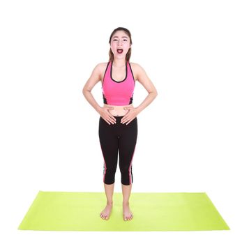 Young woman doing yoga exercise with yoga mat isolated on white background