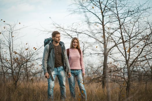 Two People Spend Vacations Time Hiking In Nature Outdoors, Young Man And Woman In Casual Clothing Have Recreational Pursuit Of Adventure Together, Healthy Lifestyle Concept