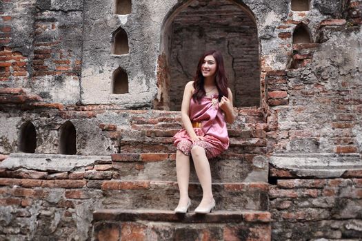 Female in Thai traditional dress at  historical park