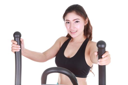 young woman doing exercises with exercise machine, on white background