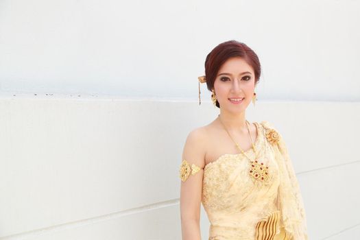 woman with Thai dress and wall background