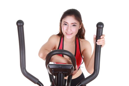 young woman doing exercises with exercise machine, on white background