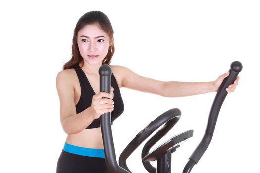 young woman doing exercises with exercise machine, on white background