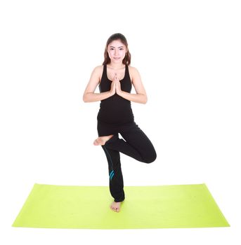 Young woman doing yoga exercise with yoga mat isolated on white background