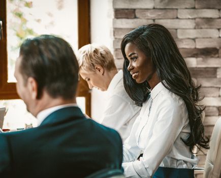 Multi-Ethnic Group At Business Meeting, Profile View Of Pretty African-American Business Woman Working With Team Of Office Colleagues, Toned Image