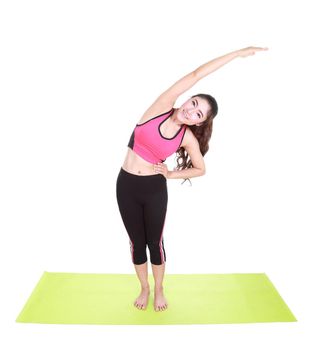 Young woman doing yoga exercise with yoga mat isolated on white background