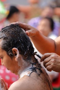 Male who will be monk shaving hair for be Ordained to new monk