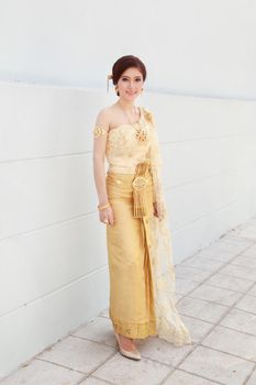 woman with Thai dress and wall background