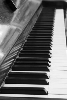 black and white piano keys and wood grain 