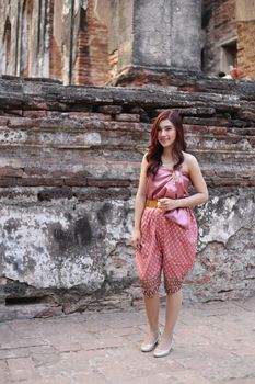 Female in Thai traditional dress at  historical park