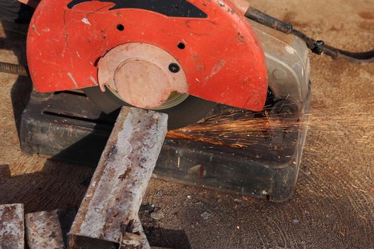 cutting a metal and steel with compound mitre saw with sharp, circular blade