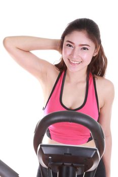 young woman doing exercises with exercise machine, on white background