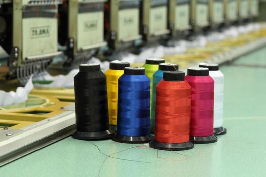 reels of thread with Machine embroider background