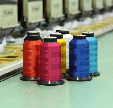 reels of thread with Machine embroider background