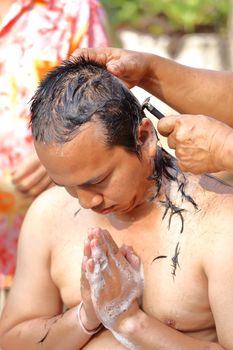 Male who will be monk shaving hair for be Ordained to new monk