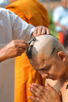 Male who will be monk shaving hair for be Ordained to new monk