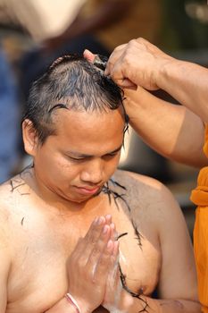 Male who will be monk shaving hair for be Ordained to new monk