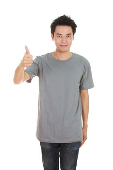 man in blank gray t-shirt with thumbs up isolated on white background