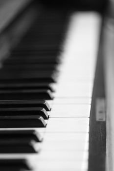 black and white piano keys and wood grain (soft focus) 