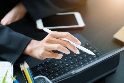 digital technology, Business woman using tablet to trade charts to find buy and sell points for her port